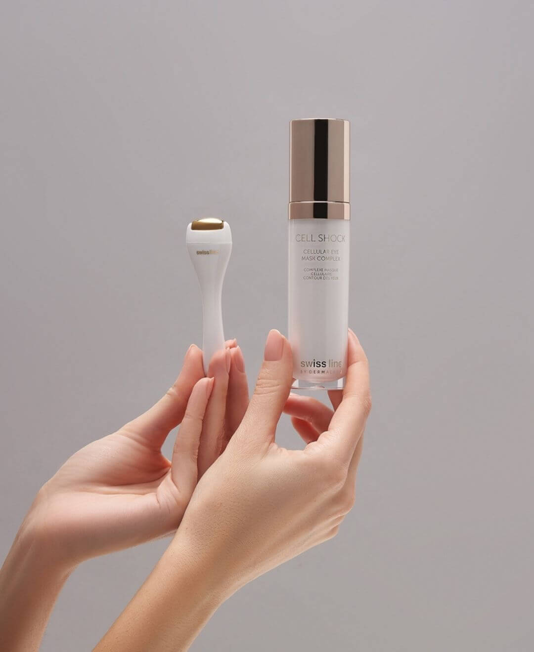 Complexe masque oculaire Cell Shock Swissline avec applicateur, tenu en main, pour lisser, hydrater et revitaliser le contour des yeux.